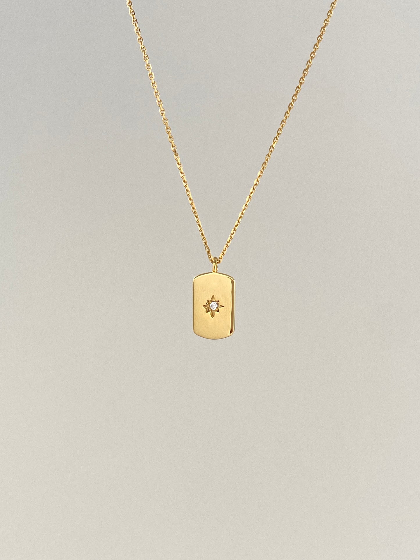 14k gold star set diamond small dog tag necklace